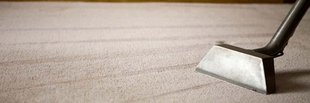 This is a photo of a carpet steam cleaner cleaning a cream carpet works carried out by Chigwell Carpet Cleaning